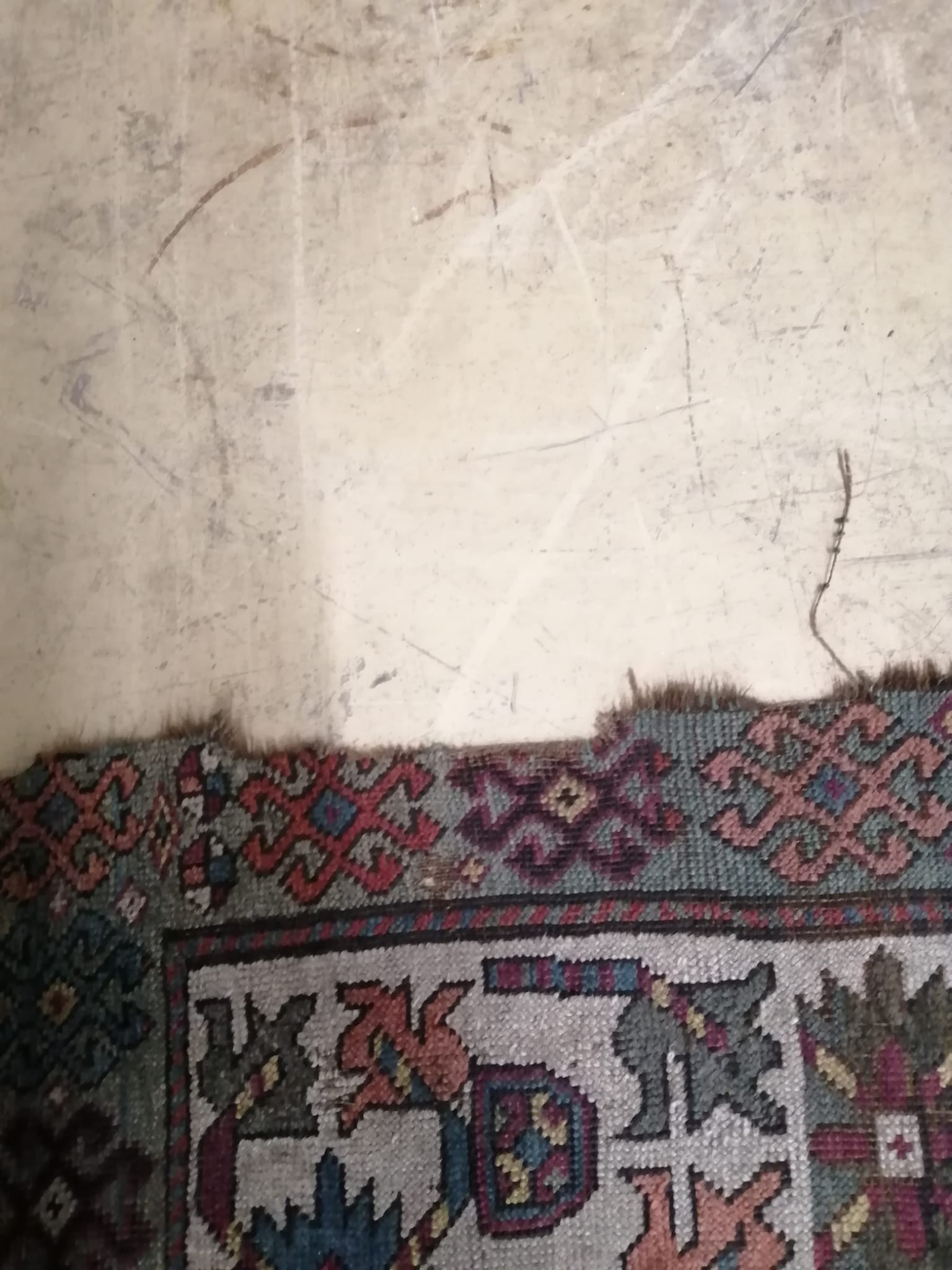 An antique Kazak rug, 310 x 150cm